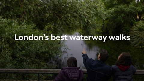 text reads: London's best waterway walks and is set upon background of three people looking over a river, the middle person pointing