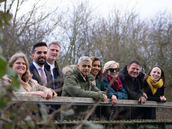 A group of people on a bridge with Mayor of London, Sadiq Khan