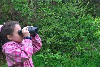 Girl with binoculars