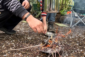Pot hanging on top of fire 