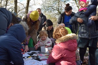 A group of children enjoying crafts outside