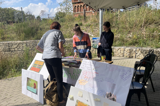 Young people at stall at Camley Street Natural Park 