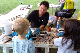 Lois, Communities and Youth Communications Officer at London Wildlife Trust supporting on the SPLASH ARTS CIC summer series in the local park in tower hamlets.