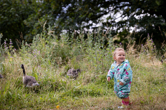Child with geese at Walthamstow Wetlands