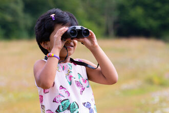 Girl with binoculars
