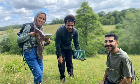 Trainees Adam, von and Nazia at Hutchinson's bank.