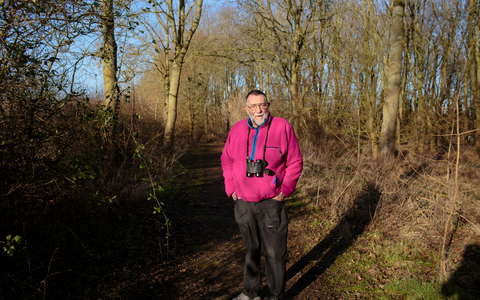 Vic stands in a woodland