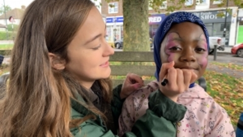 Child getting a butterfly facepaint