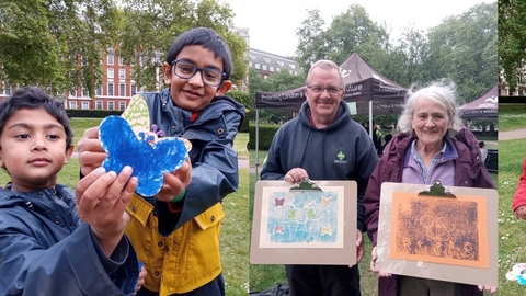 Children and adults with butterfly artwork at Grosvenor Square