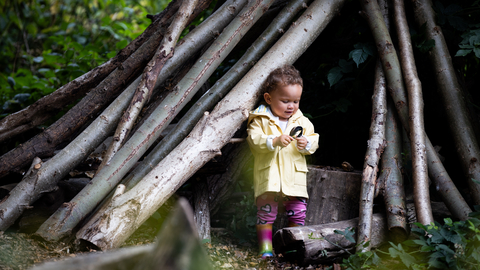 Child at Walthamstow Wetlands in a den