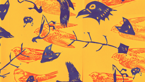 Print of animals and trees in purple on top of a yellow print of birds.