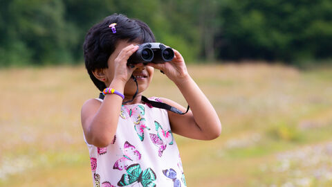 Girl with binoculars