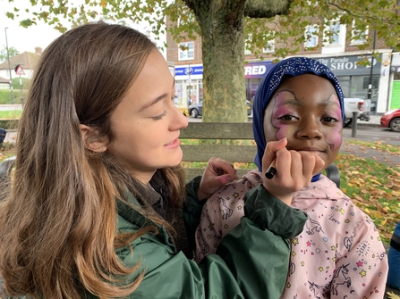 Child getting a butterfly facepaint