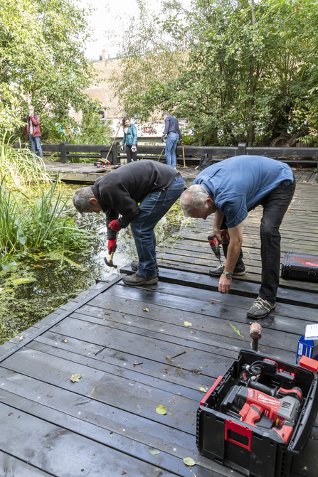 Volunteers working on repairing the pond dipping platform at Camley Street
