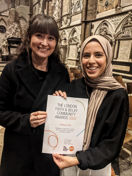 Emily and Nazia accepting the award.