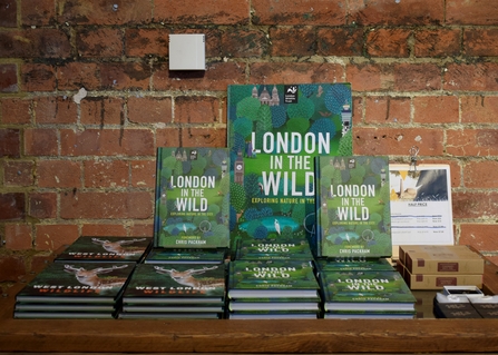 a collection of London in the wild books with a green front cover filled with illustrated leaves and text the reads london in the wild