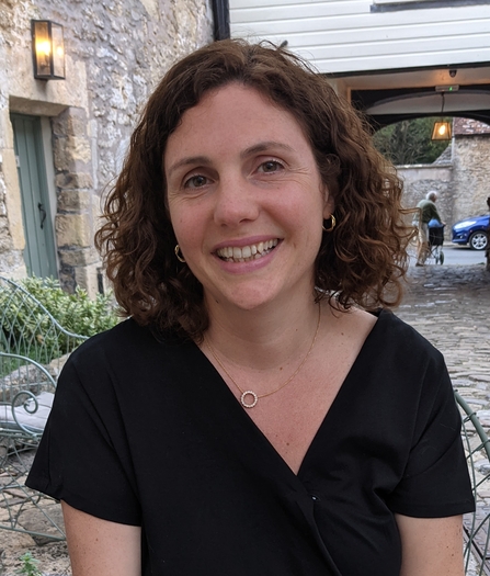 Image of a woman sitting outside