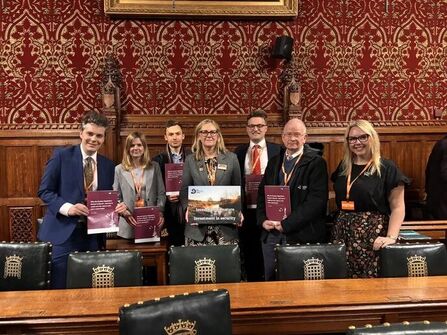 Representatives from The Wildlife Trusts standing in a group holding report