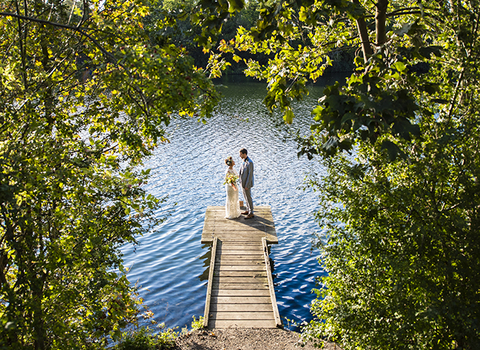 Bride and groom on pontoon at Walhamstow Wetlands