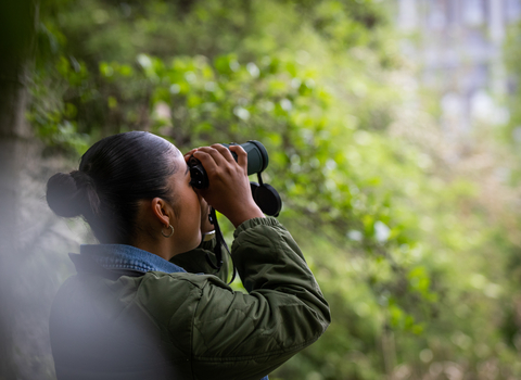 Young person bird watching 