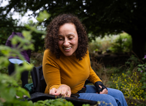 Woman at Walthamstow Wetlands herb garden